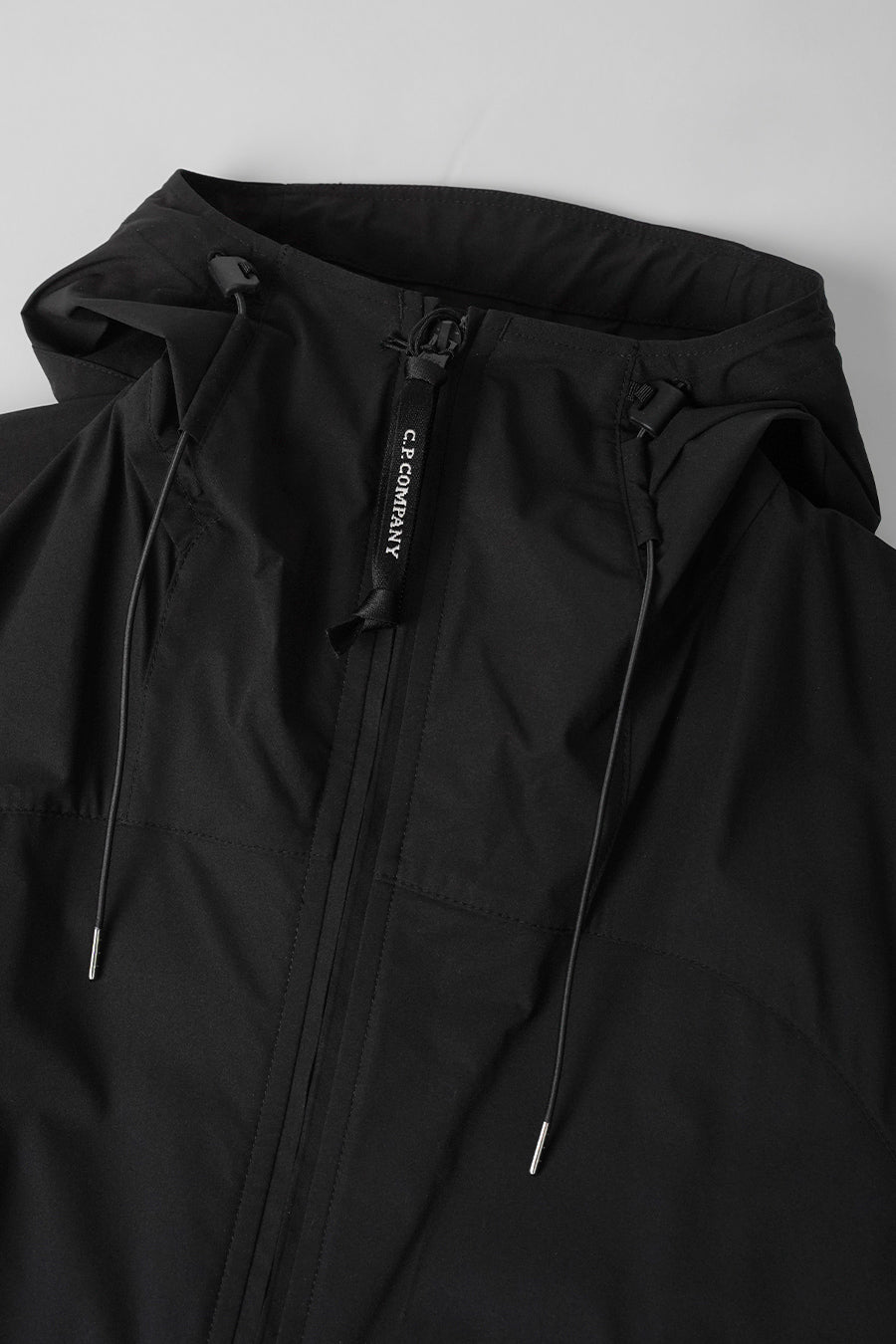 CP COMPANY - VESTE À CAPUCHE PRO-TEK LENS NOIRE - LE LABO STORE
