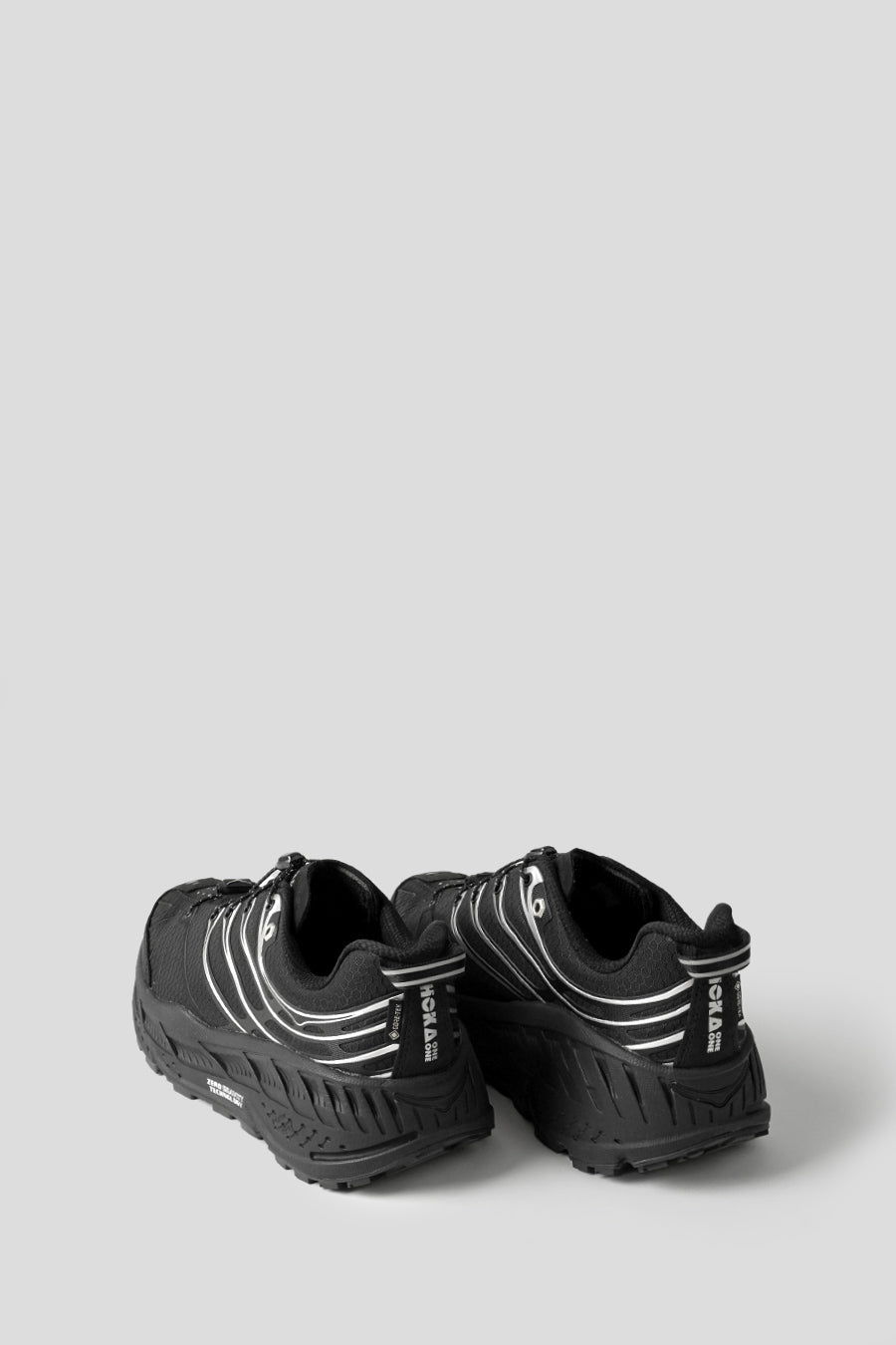 HOKA ONE ONE - SNEAKERS STINSON EVO GTX BLACK ET SLIVER - LE LABO STORE