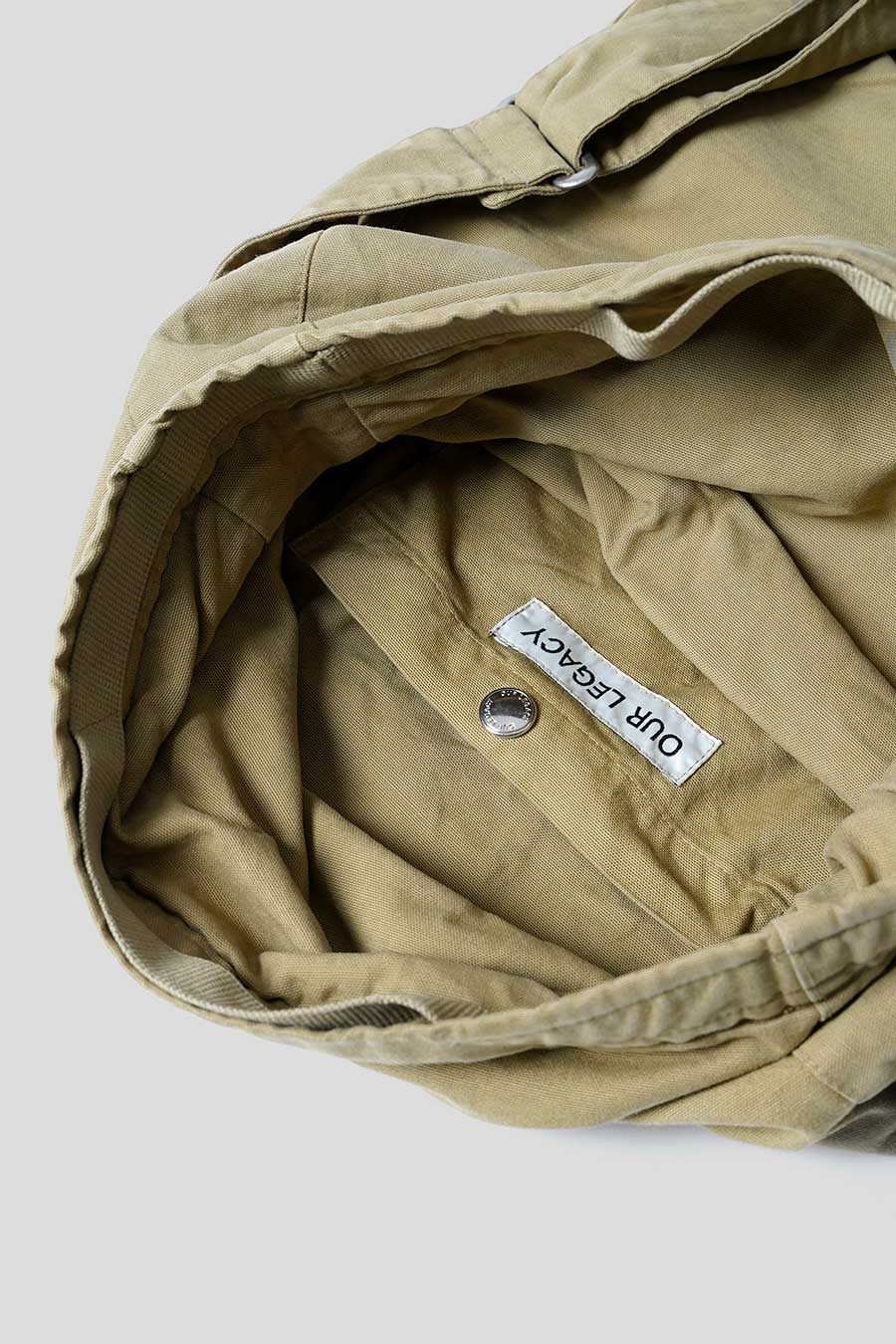 Our Legacy - WASHED KHAKI SLING BAG – LE LABO STORE