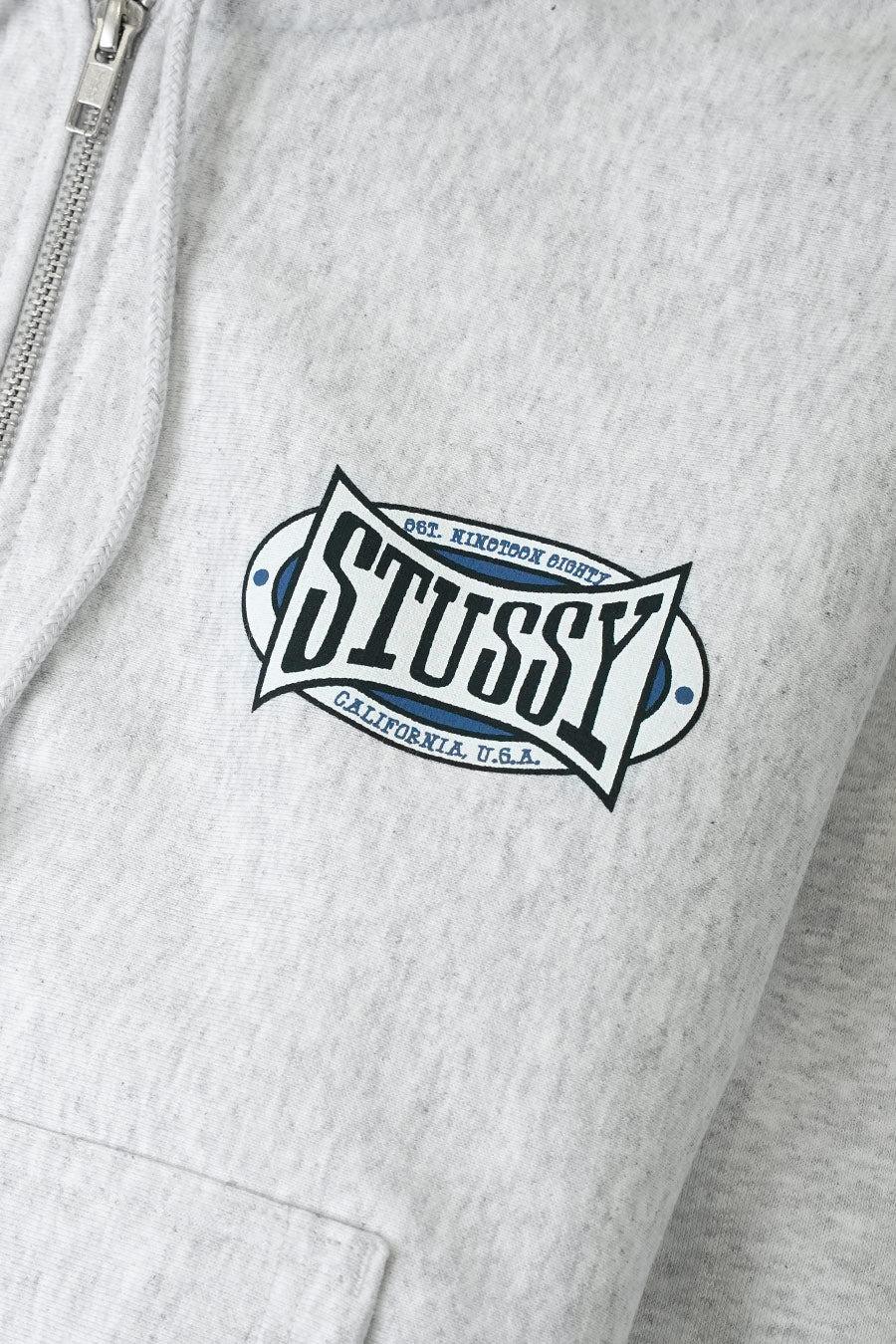 Stussy - HOODIE ZIP CHAMPION OVAL GRIS CHINÉ - LE LABO STORE