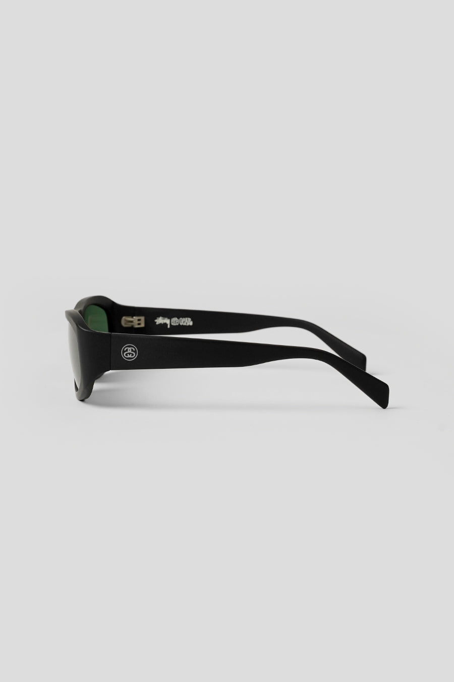 Stussy - MATTE BLACK AND GREEN LENS LANDON SUNGLASSES – LE LABO STORE