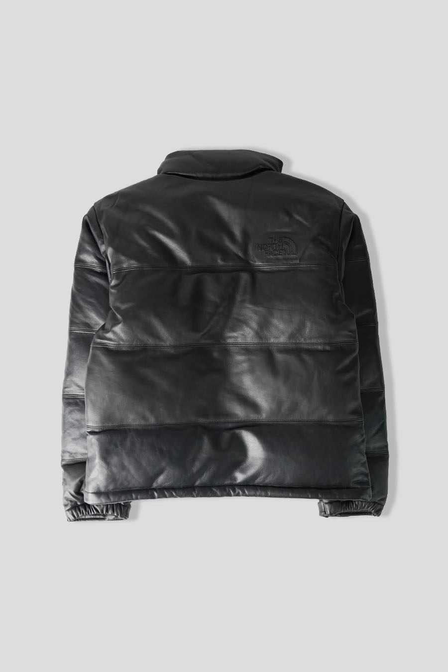 The North Face - DOUDOUNE LEATHER PACK 1996 NUPTSE NOIRE - LE LABO STORE