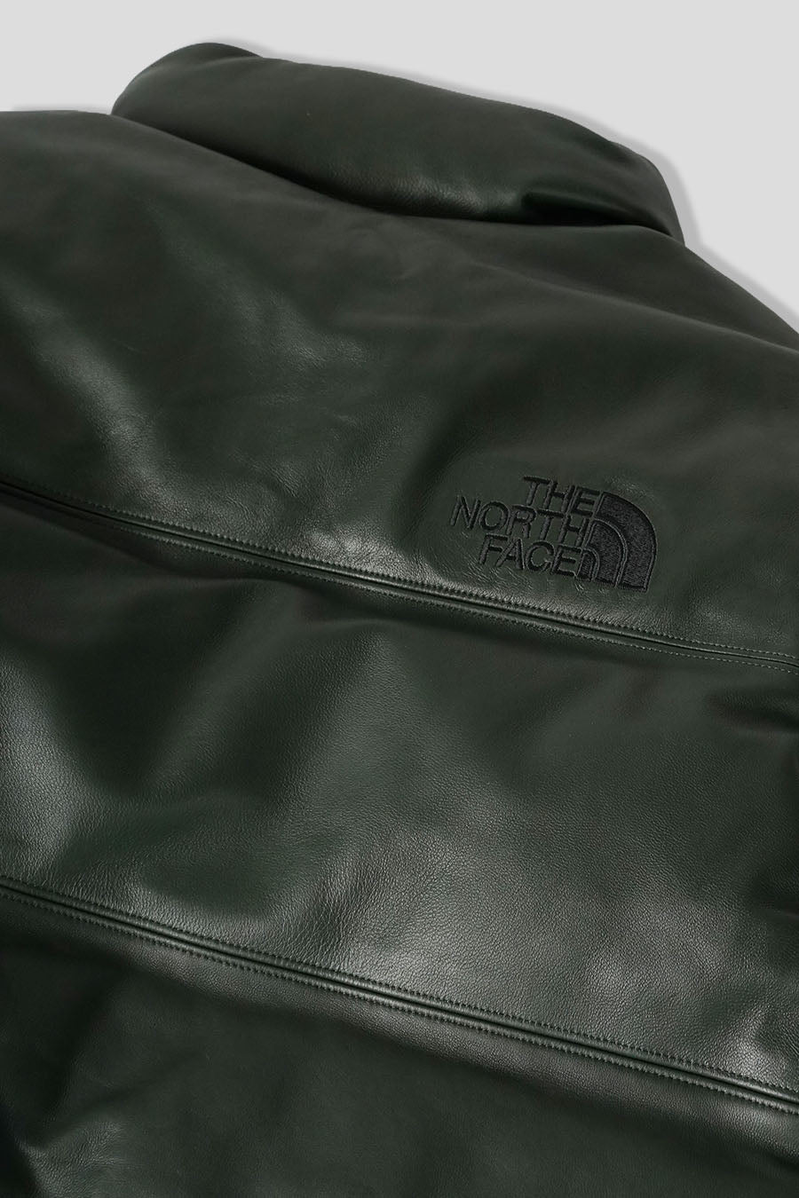 The North Face - LEATHER PACK 1996 NUPTSE DOWN JACKET DARK GREEN - LE LABO STORE