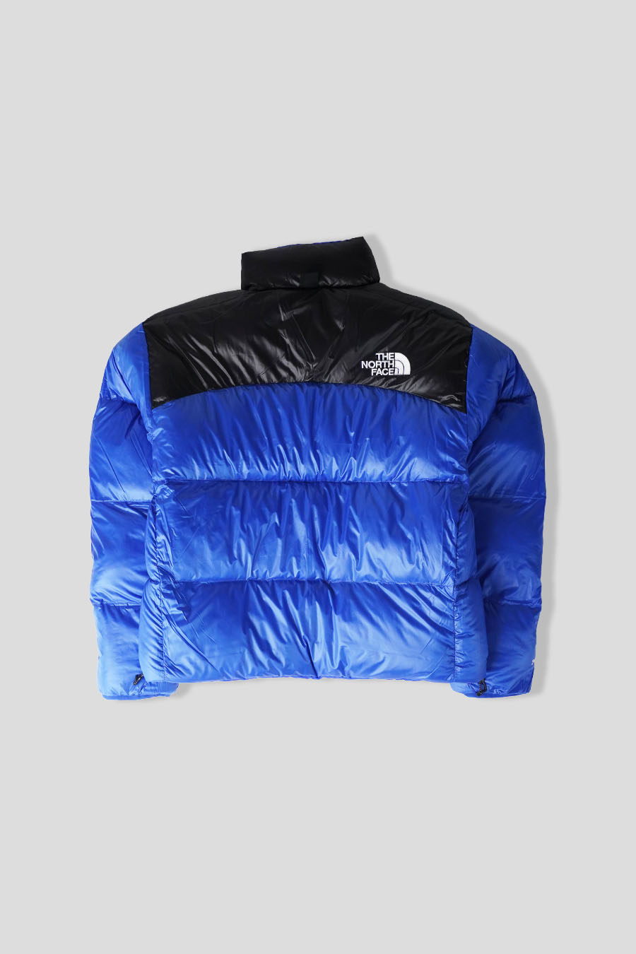 The North Face - DOUDOUNE PERTEX NUPTSE REVERSIBLE BLEUE ET NOIRE - LE LABO STORE