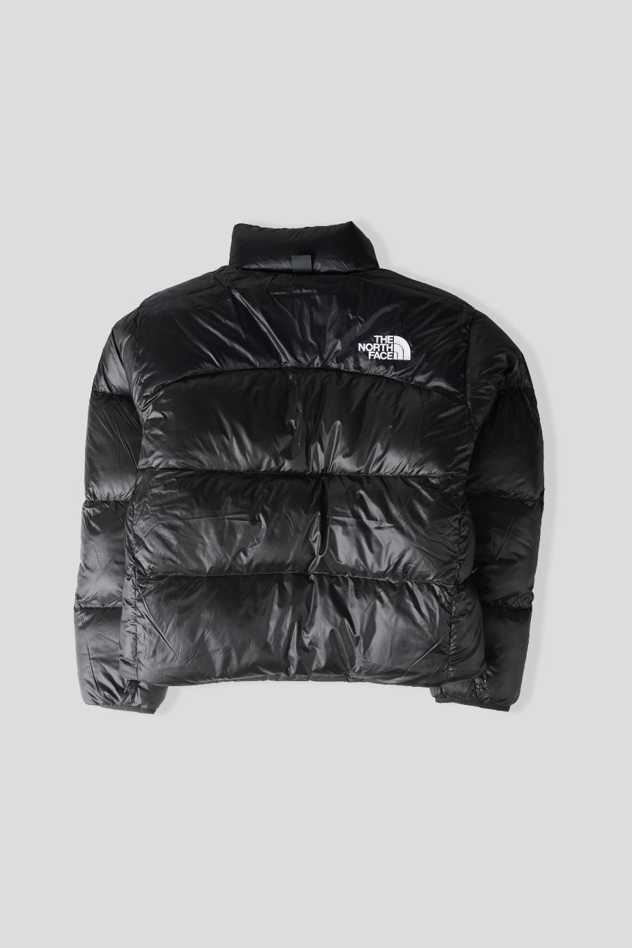 The North Face - DOUDOUNE PERTEX NUPTSE REVERSIBLE NOIR CHARBON - LE LABO STORE