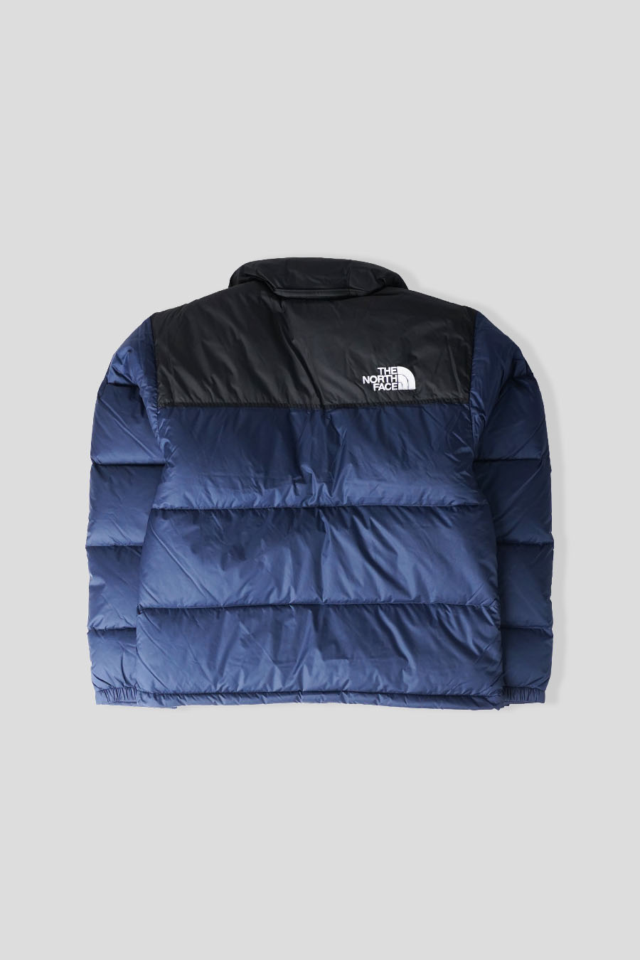 The North Face - DOUDOUNE 1996 RETRO NUPTSE BLEU FONCÉ ET NOIRE - LE LABO STORE